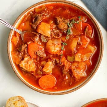 Closeup on a bowl of beef cabbage soup.