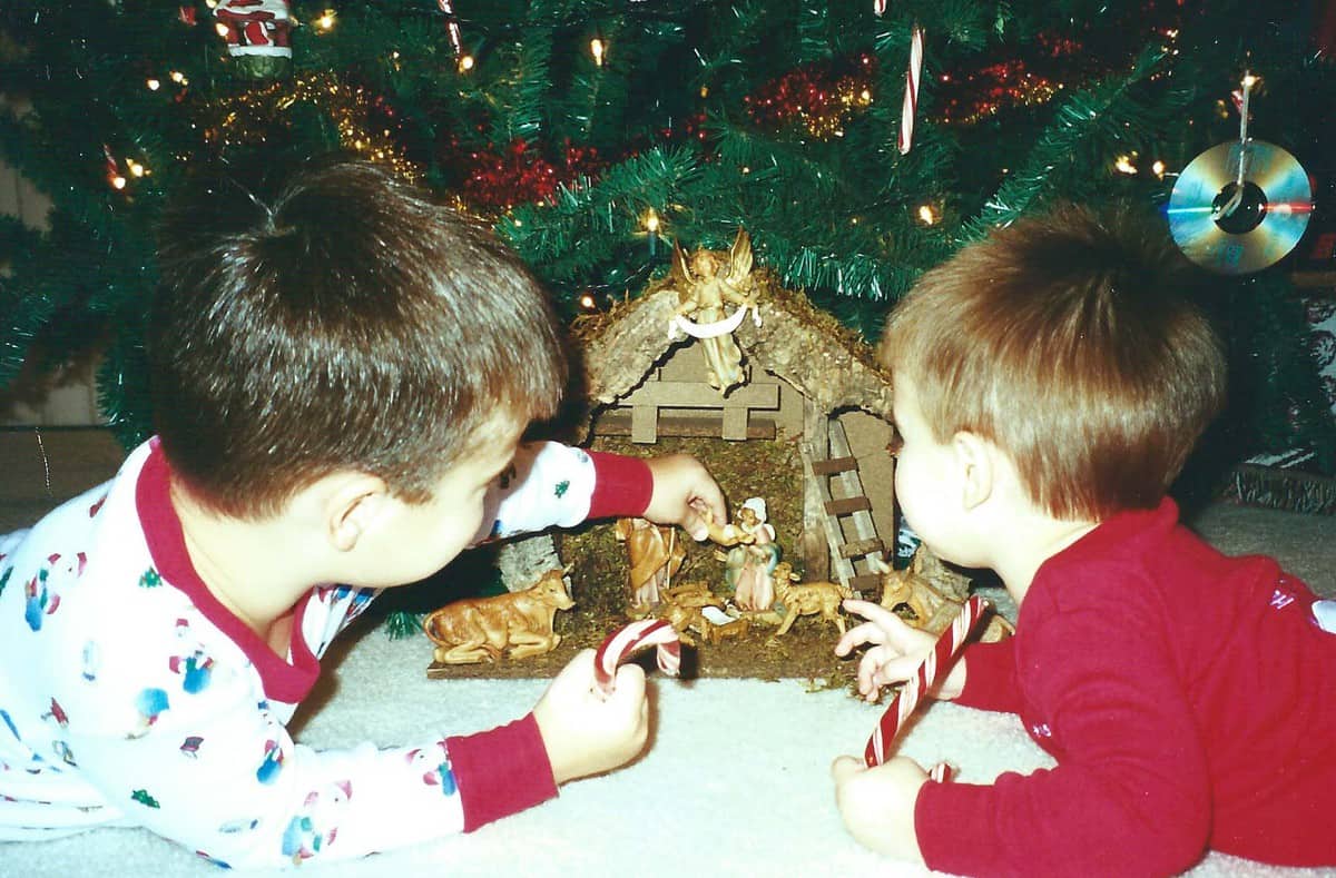 The boys by the nativity set.