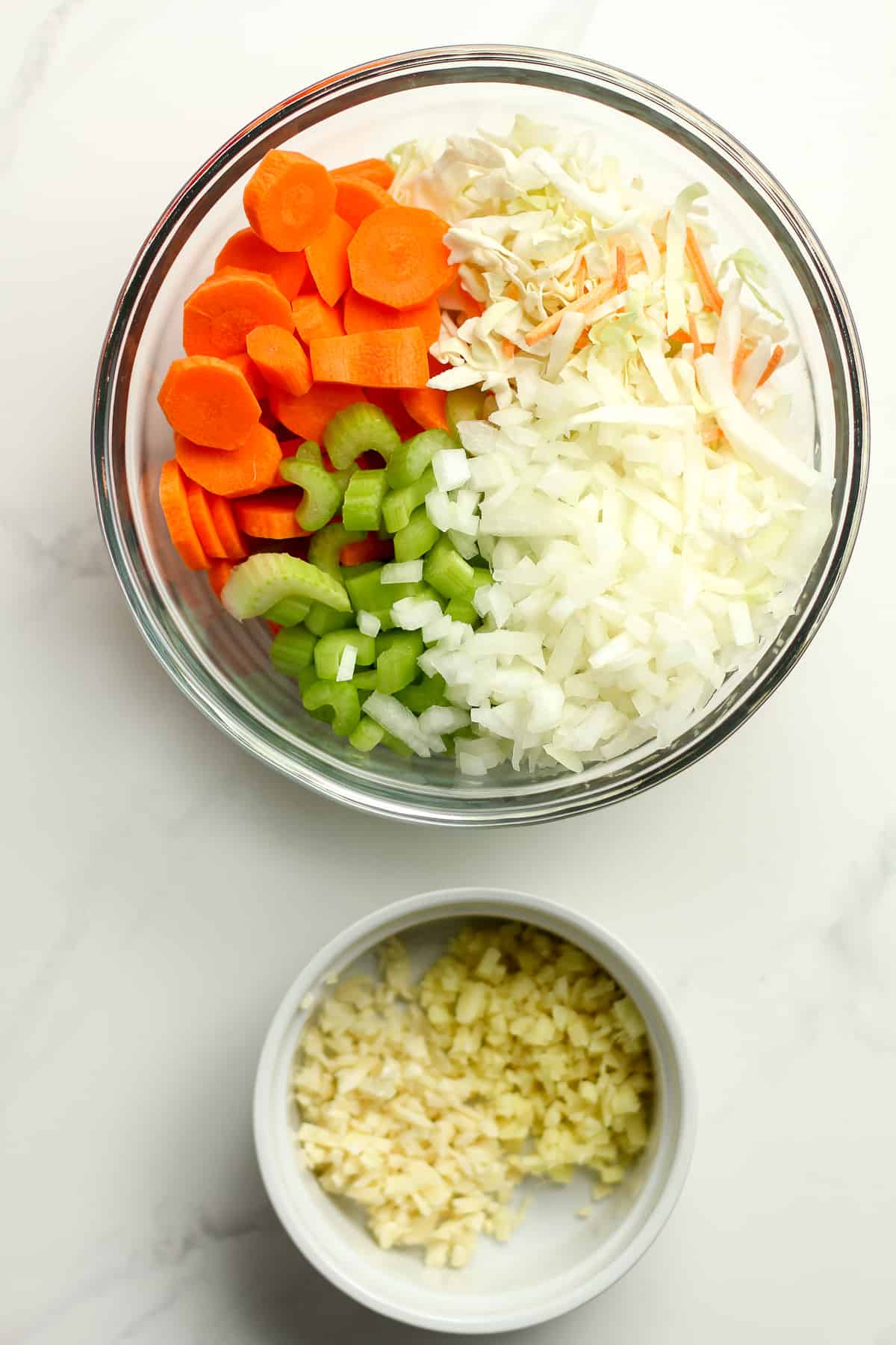 Bowls of chopped veggies.