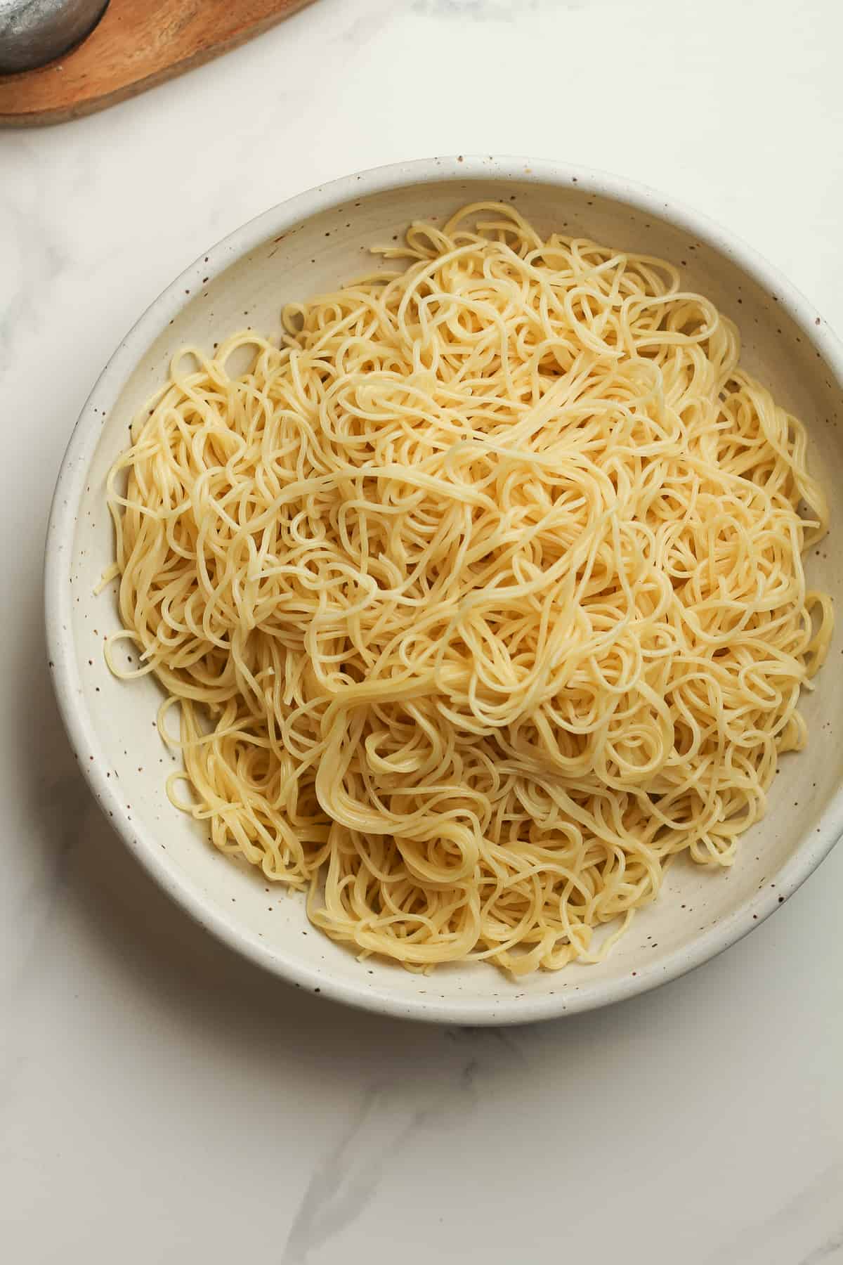 A bowl of angel hair pasta.