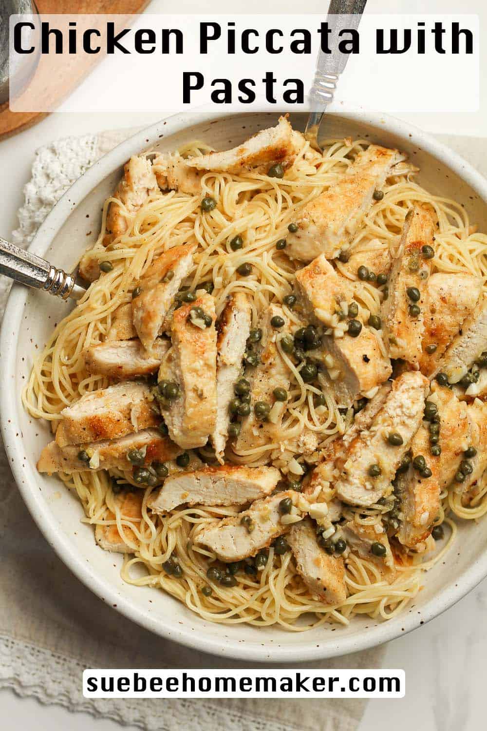 A bowl of pasta with chicken piccata.