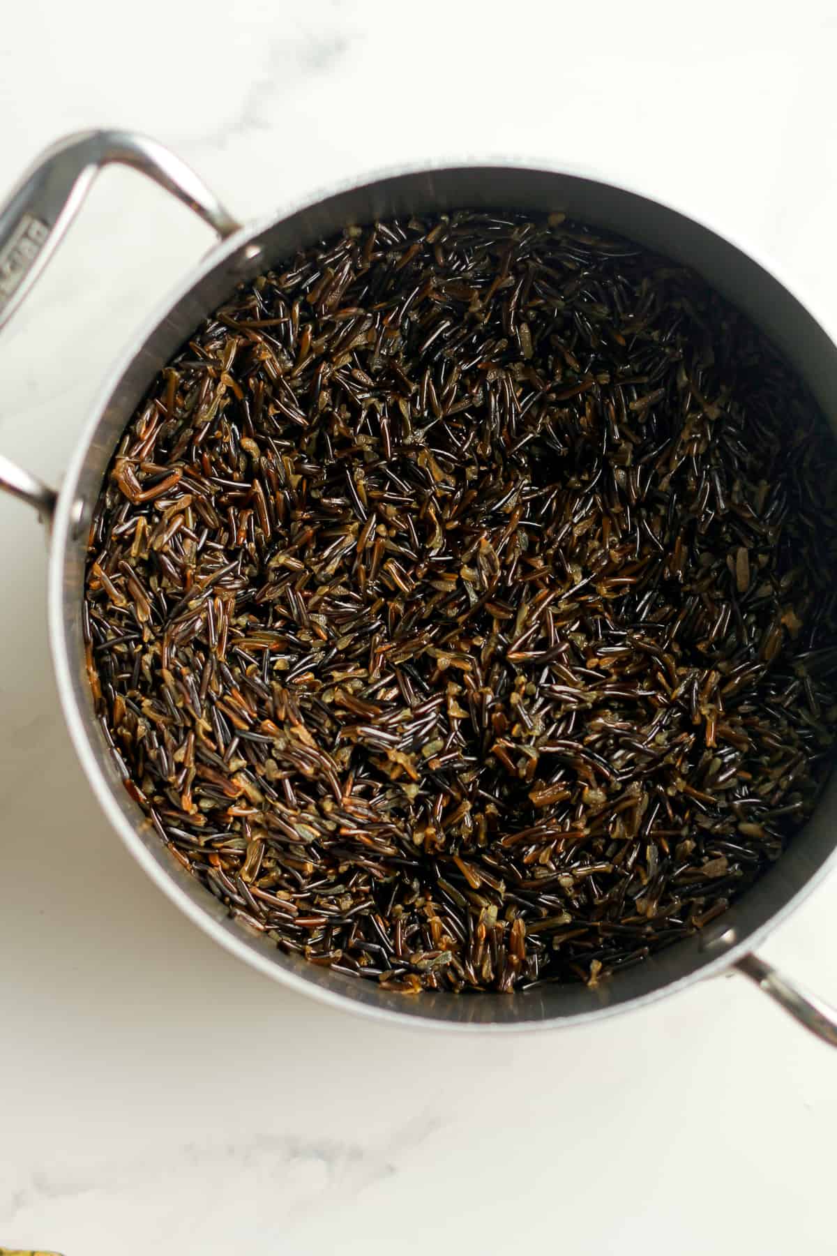 A pot of cooked wild rice.