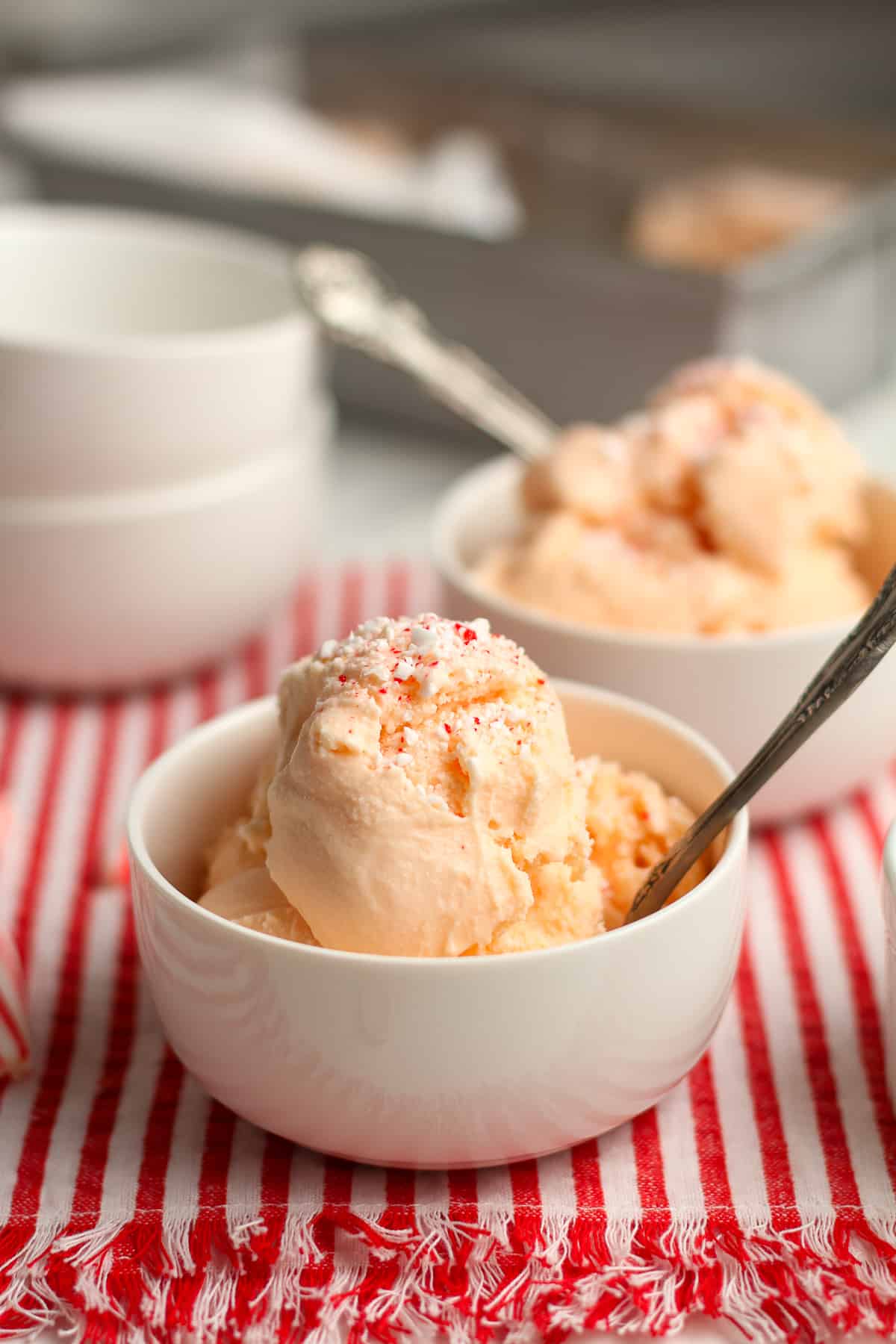 Side view of two bowls of ice cream, with the pan in the background.
