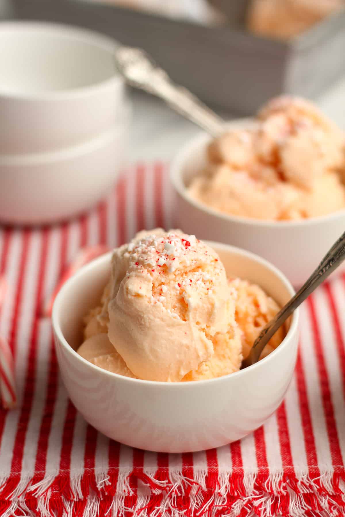 Side view of two bowls of peppermint stick ice cream.