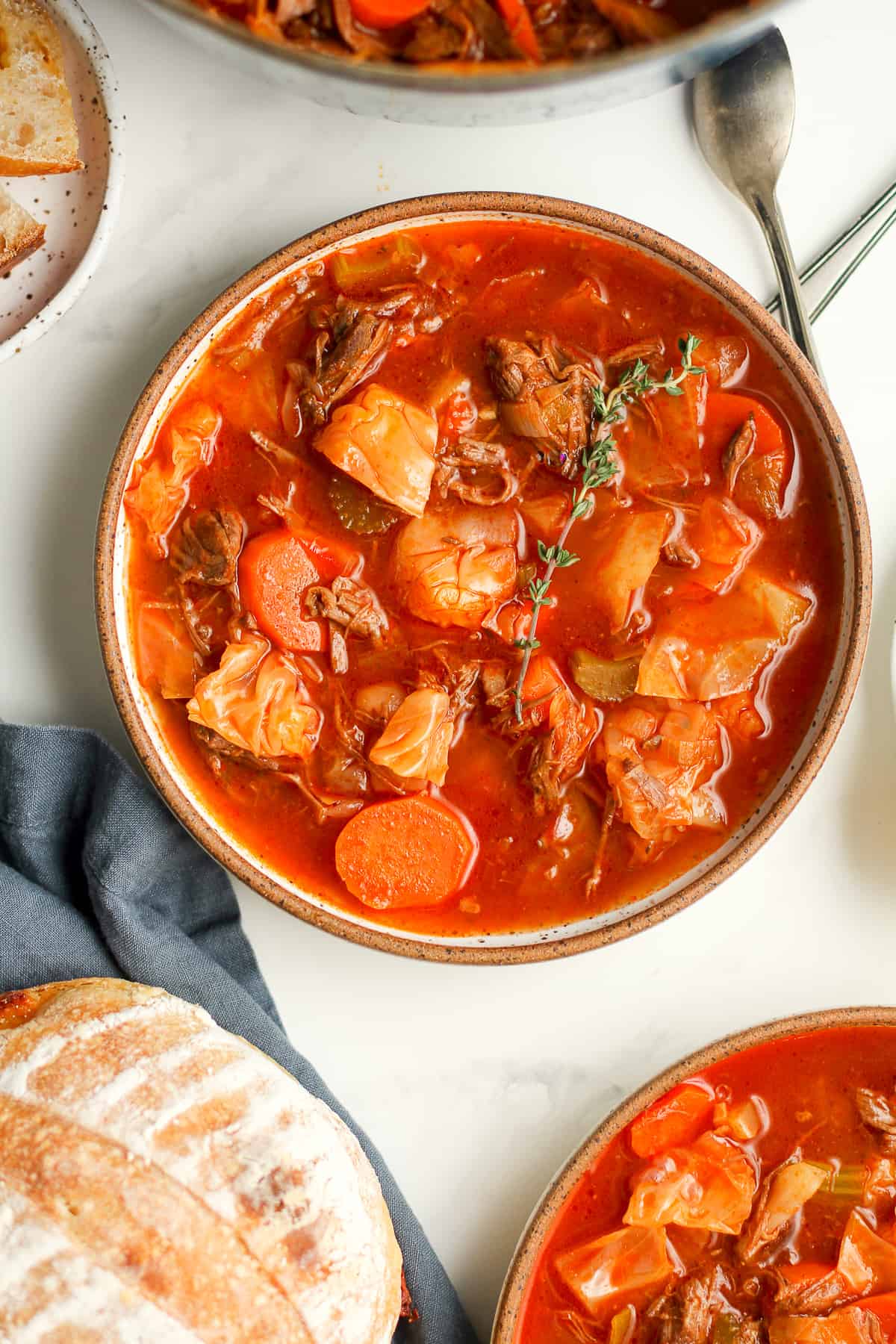 Two bowls of beef and cabbage soup.