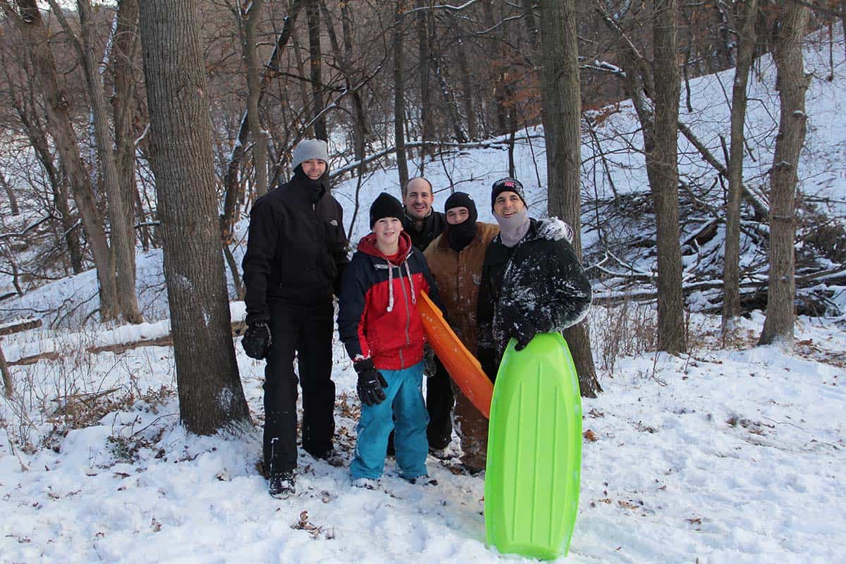 Mike and his brothers plus our two boys in the snow with sleds.