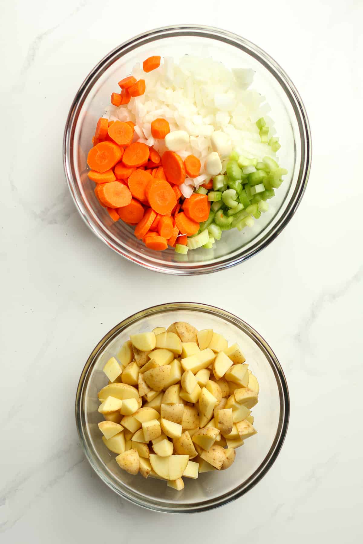 Two bowls of the chopped veggies.