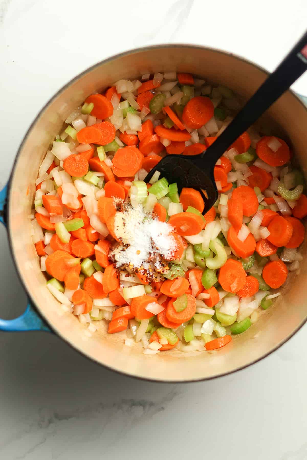 A stock pot of the carrots, onion, celery, and seasonings.