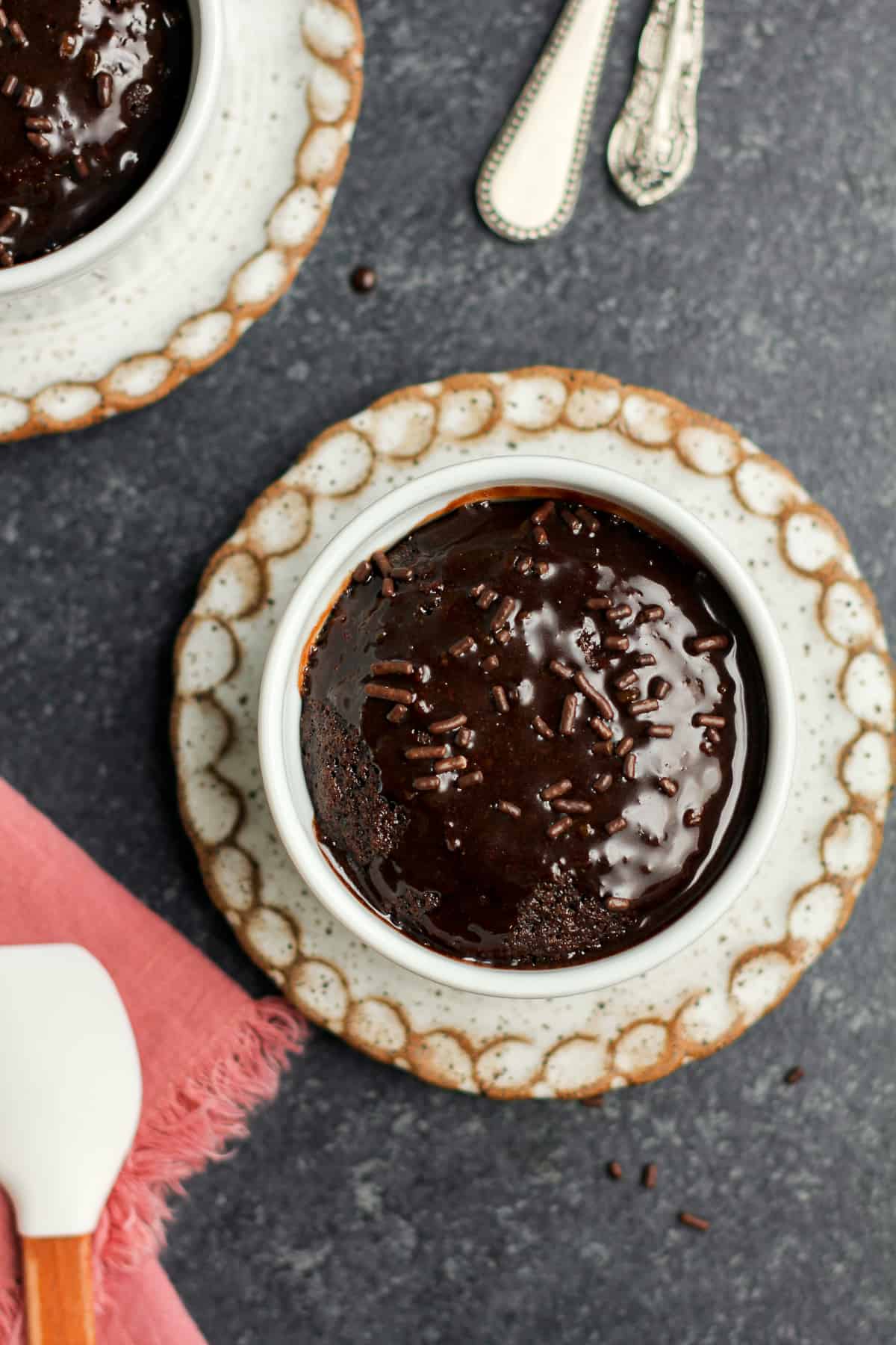 Two small ramekins of chocolate cake for two.