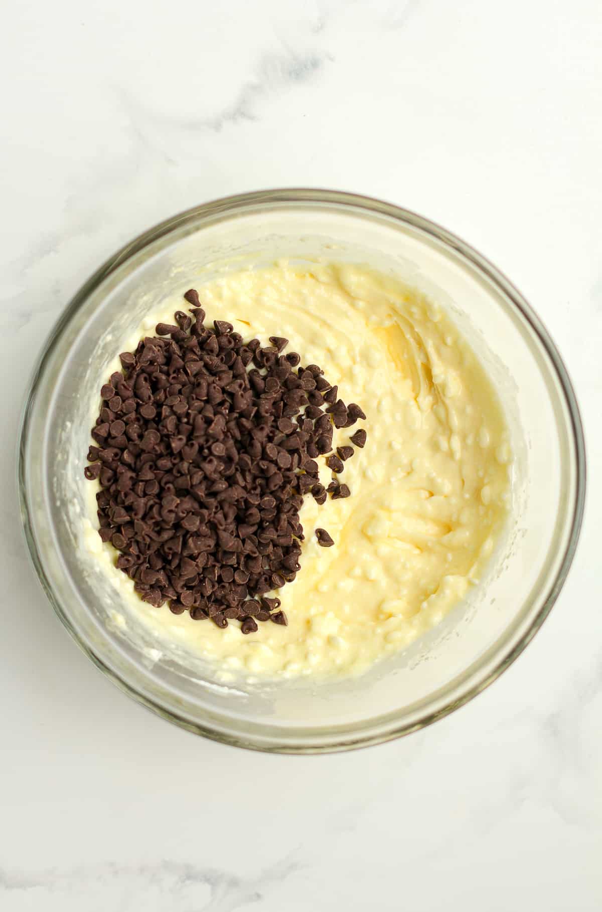 A bowl of the mixed filling mixture, with the mini chocolate chips added on top.
