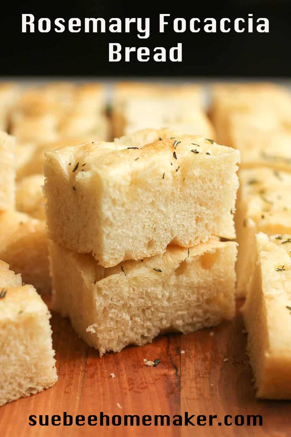 A stack of two pieces of focaccia bread with others around it.