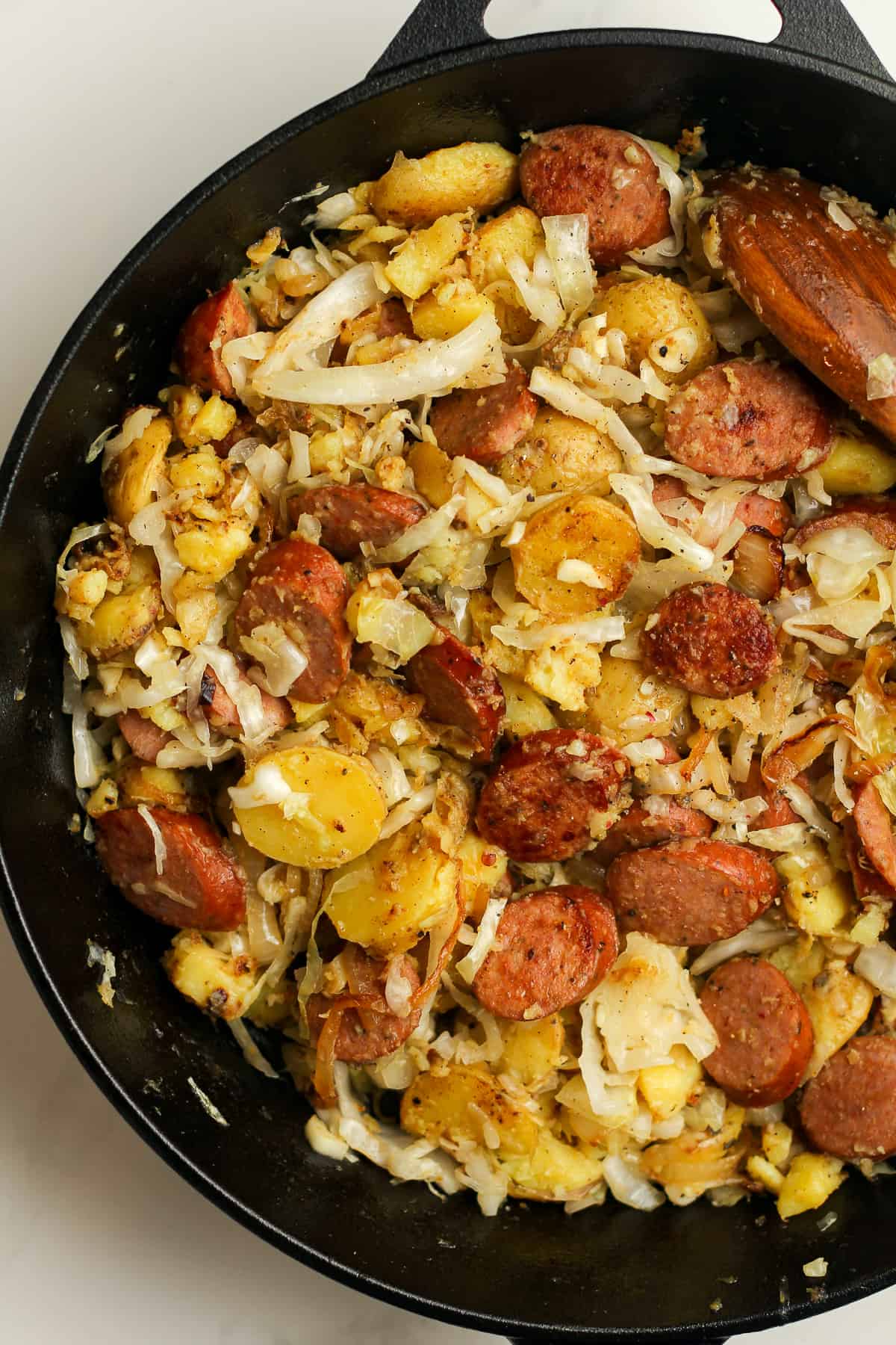 Closeup on the finished skillet of sauerkraut and sausage.