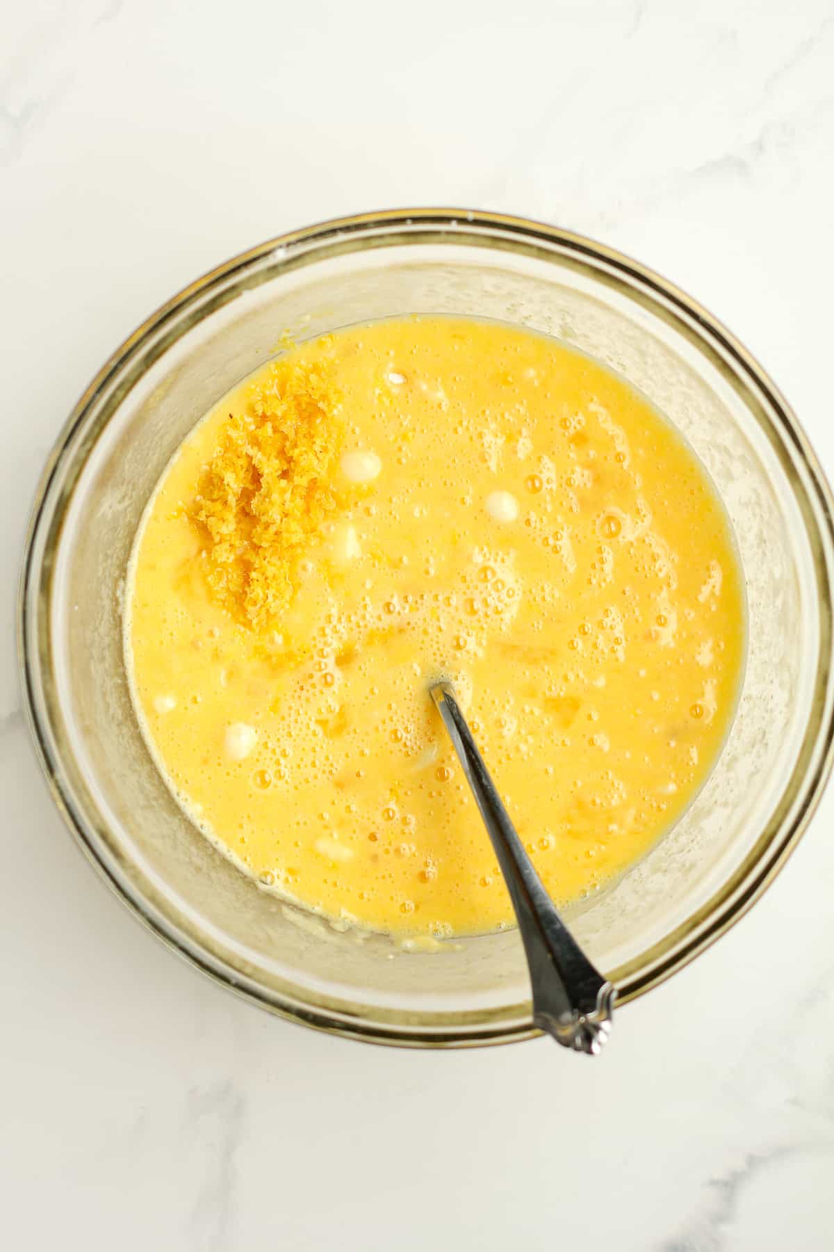 A bowl of the lemon filling with the zest on top.