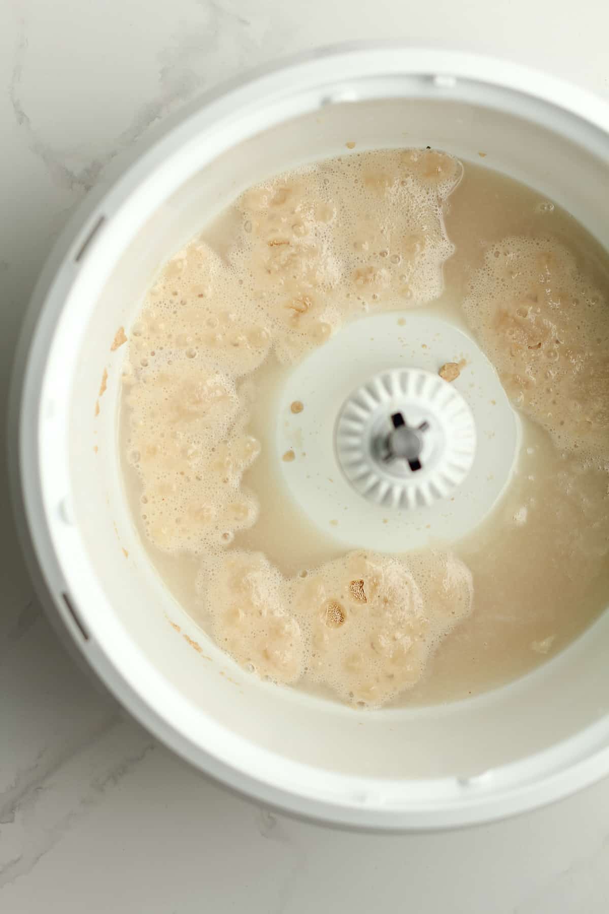 A mixer with the bubbly yeast mixture.