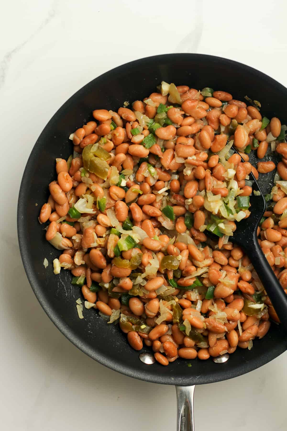 A saute pan of the veggies plus pinto beans.