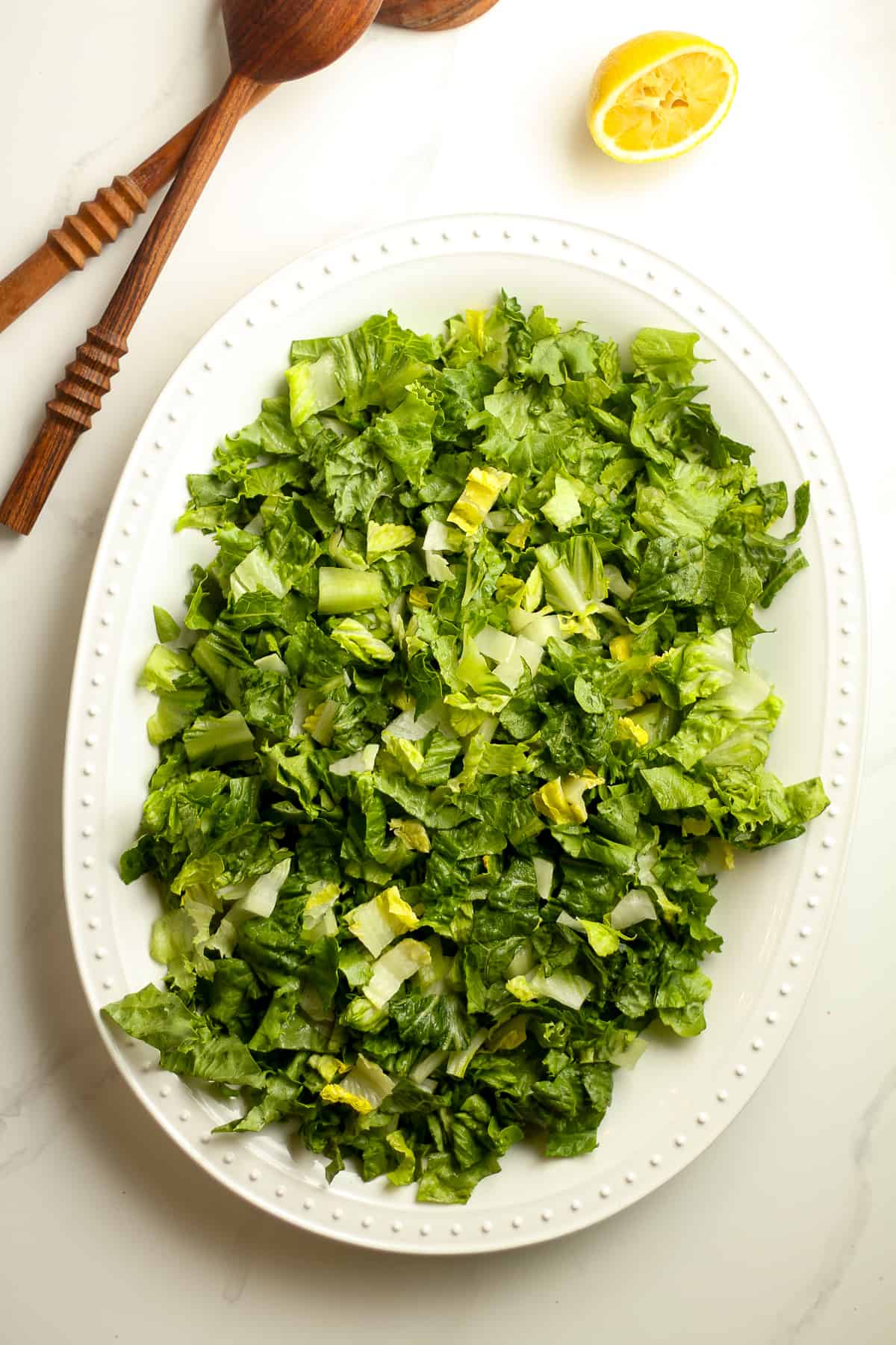 A white platter of the lettuce.