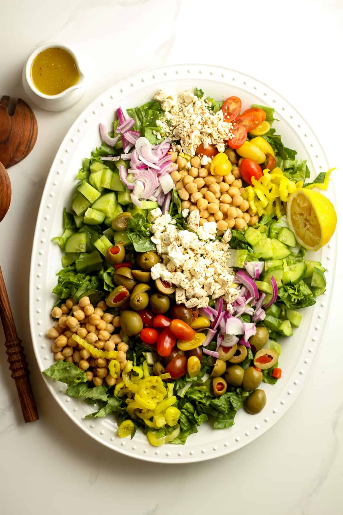 Overhead shot of the Greek chopped salad with Greek dressing.