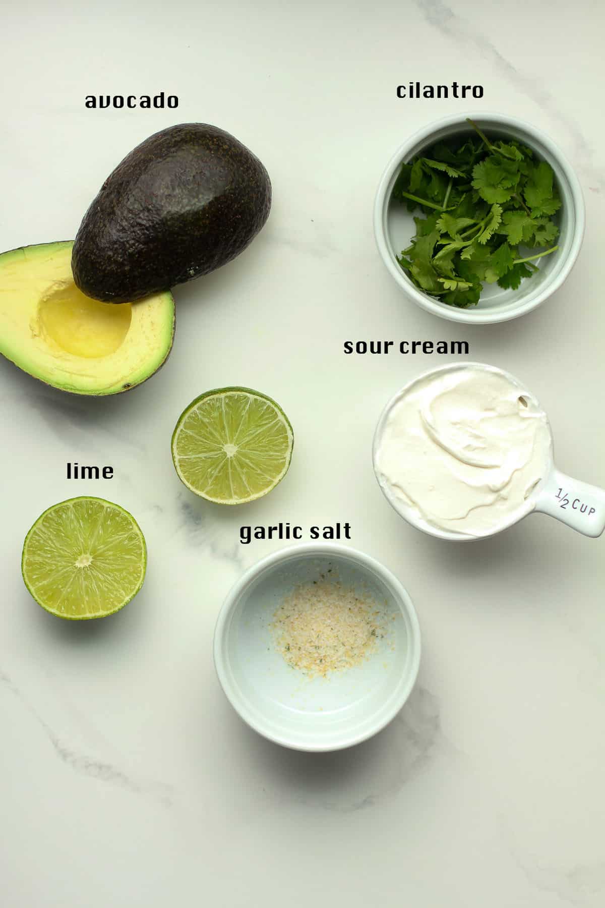 A board with the Avocado Crema ingredients, labeled.