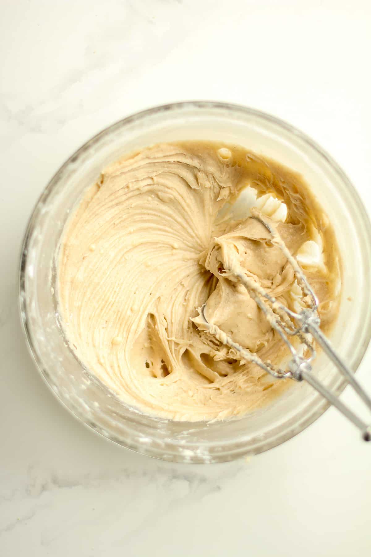 A bowl of the cream cheese frosting.