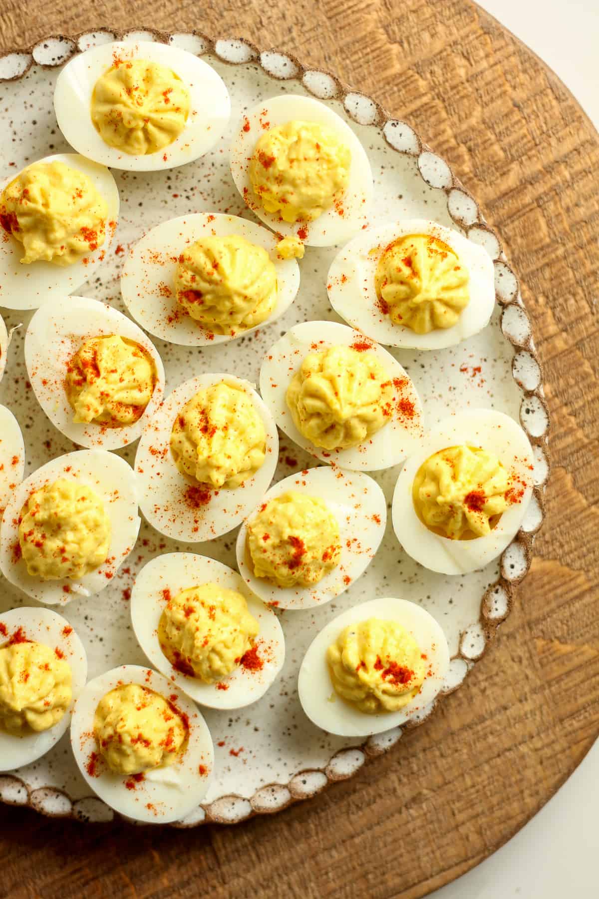 A partial shot of a plate of deviled eggs.