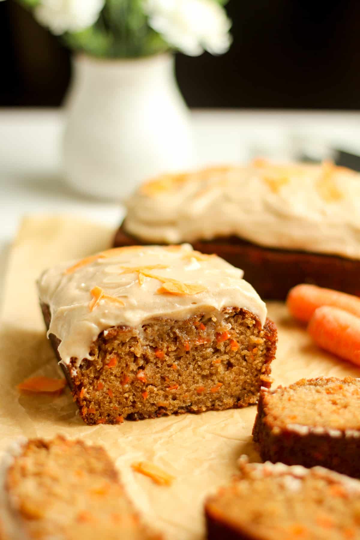 Side shut of a partial loaf of easy carrot cake loaf.