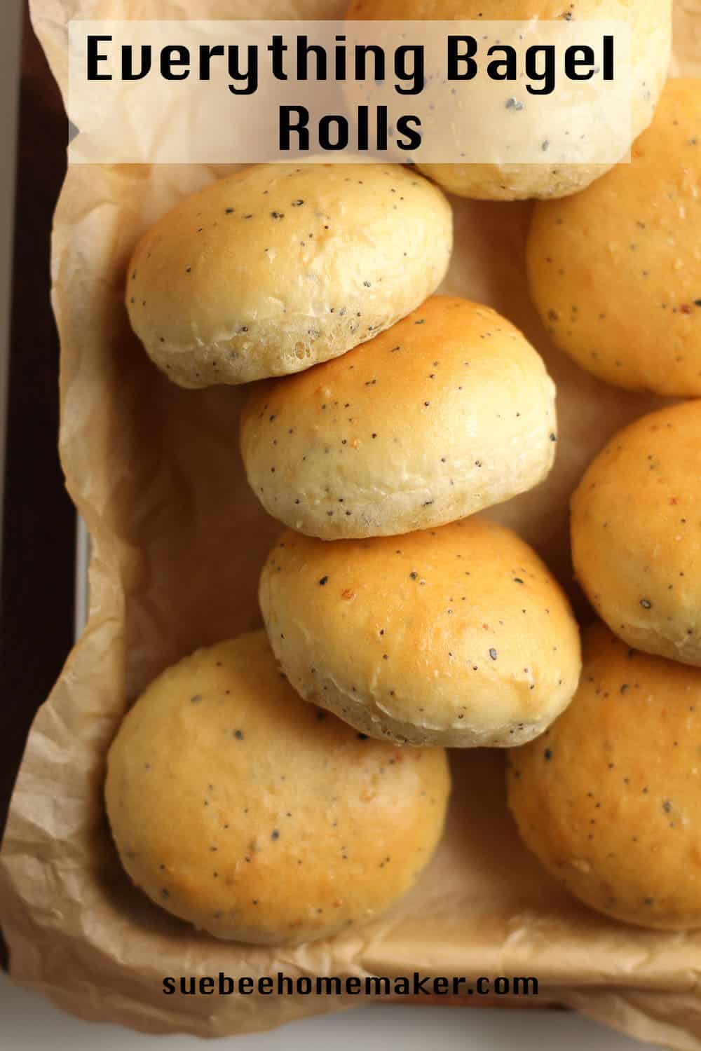 Some freshly baked rolls on a baking sheet.