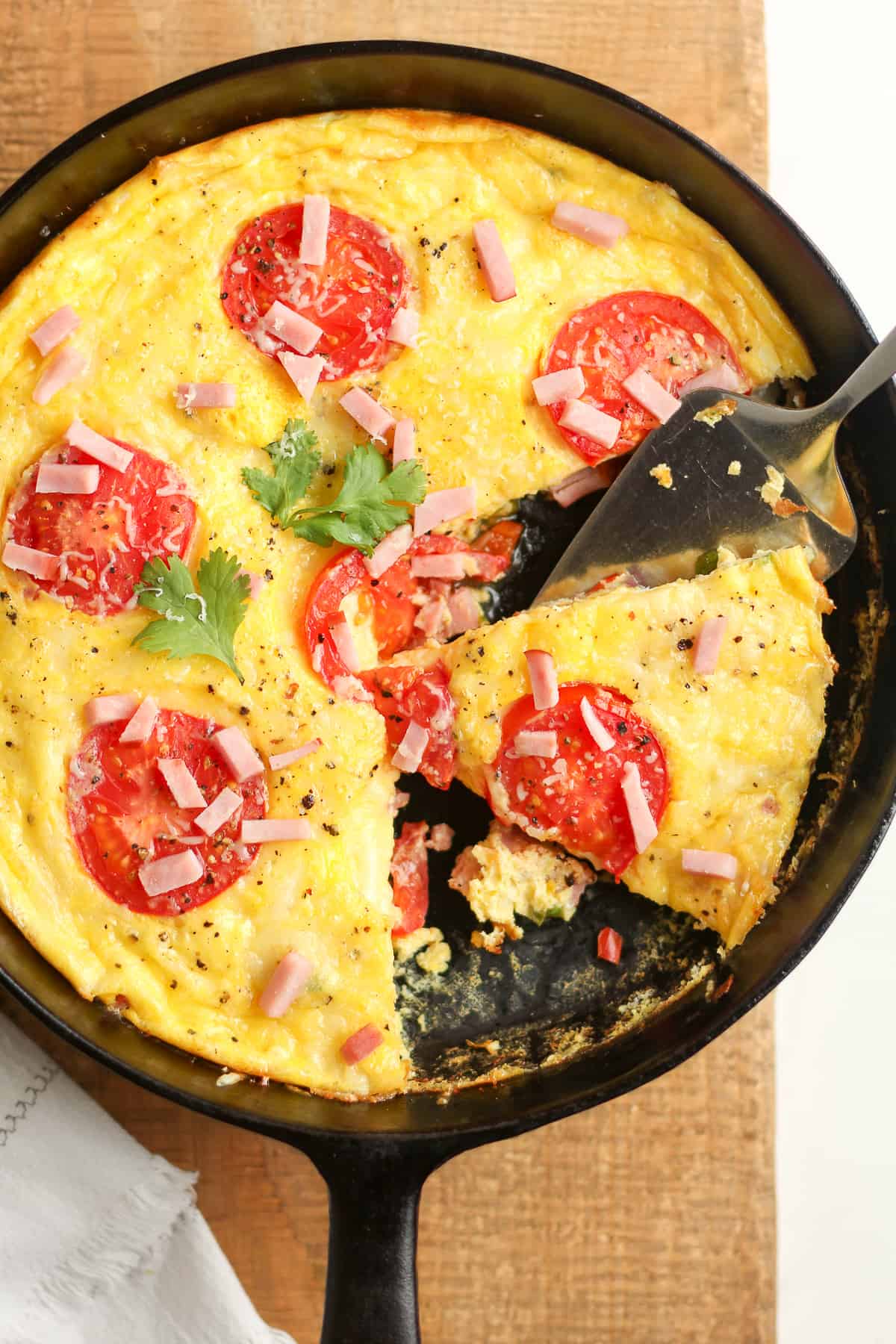 A skillet with a partial frittata.