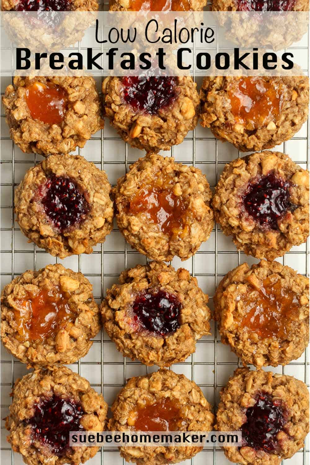 Peanut butter oatmeal breakfast cookies with jam centers on a cooling rack.