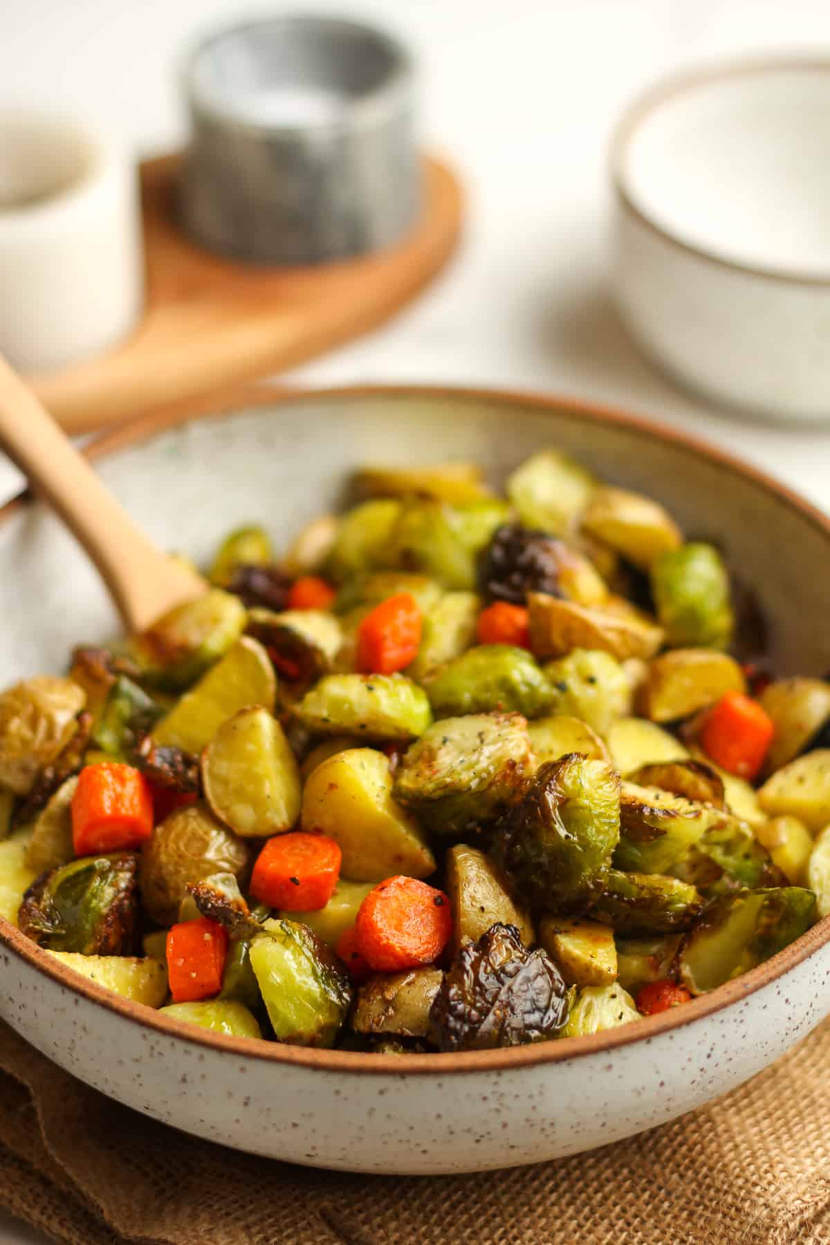 Side view of a bowl of roasted veggies.