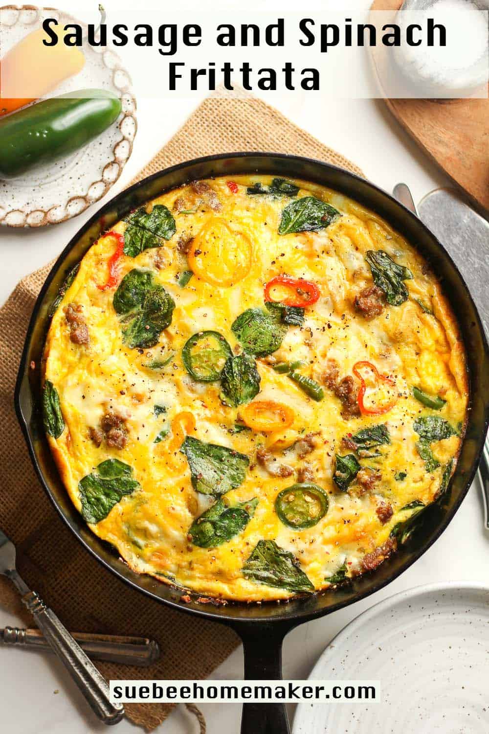 A cast iron skillet of the sausage frittata with veggies.