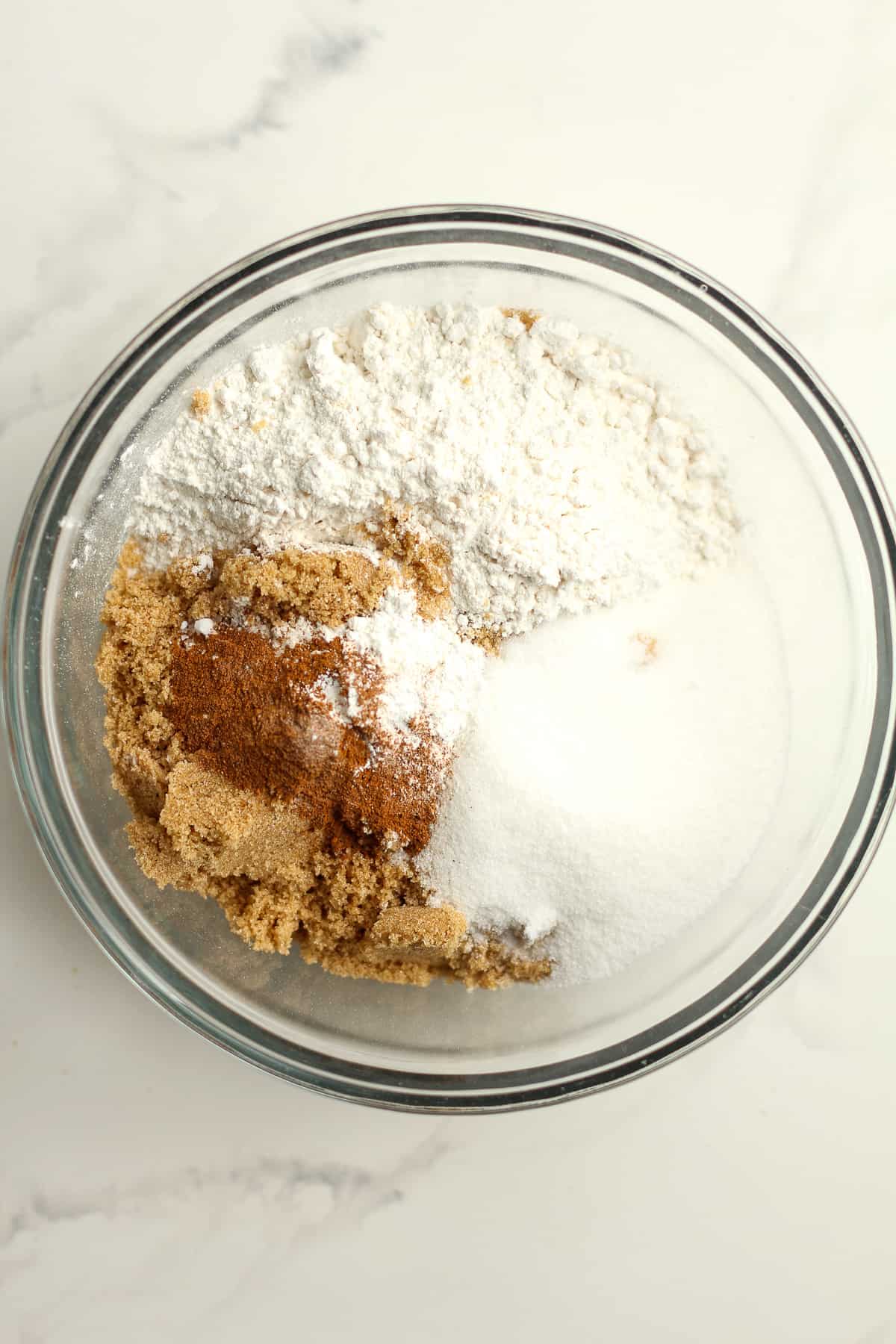 A bowl of the dry ingredients - flour, sugars, spices, etc.