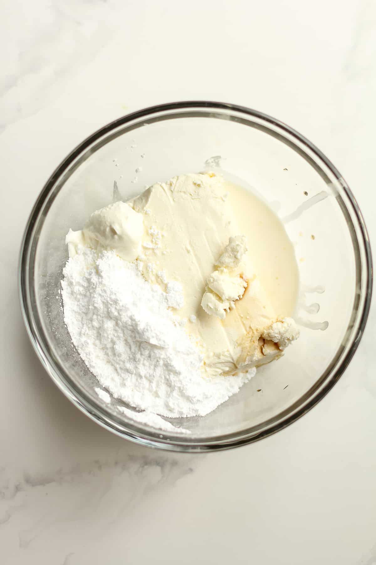 A bowl of the cream cheese filling ingredients, before mixing together.