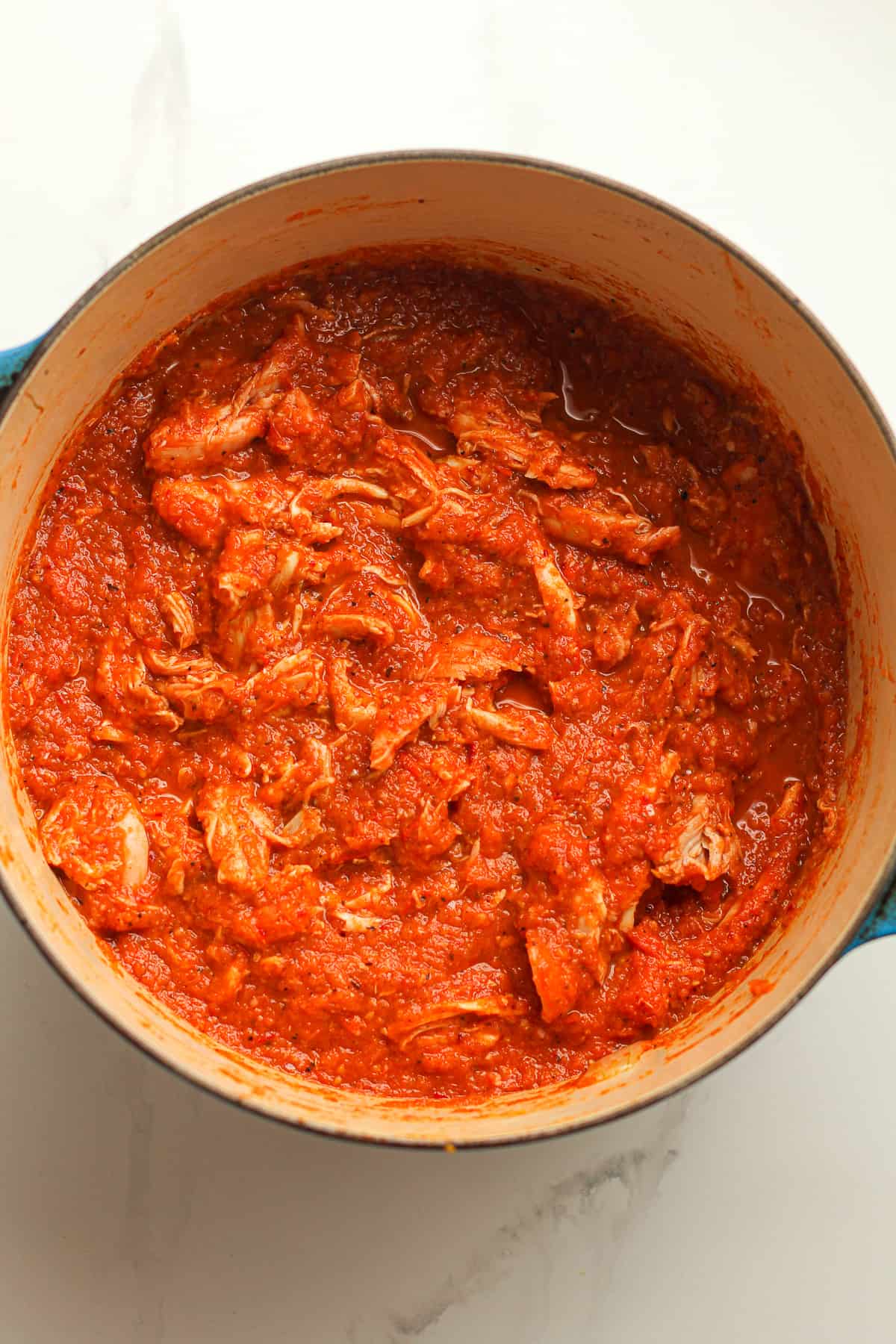 A stock pot of chicken Tinga sauce.
