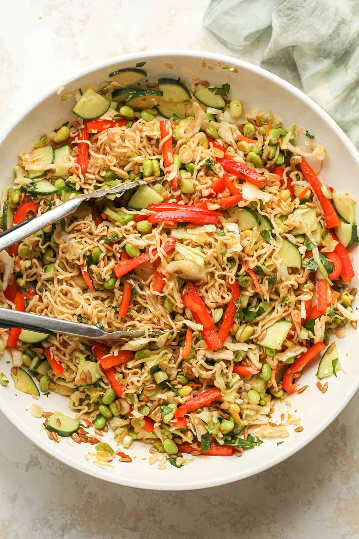 Overhead shot of a large bowl of ramen salad with veggies and dressing.