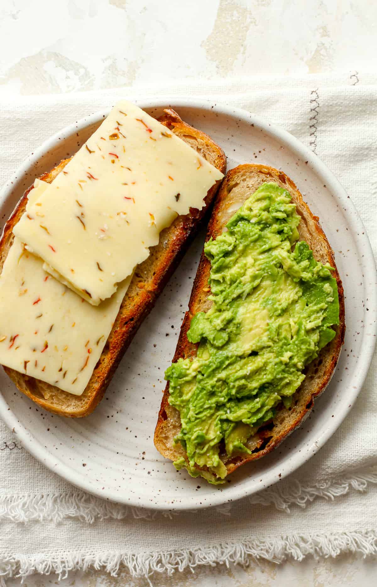 Garlic sourdough bread, toasted with pepper jack cheese and smashed avocado (two slices).