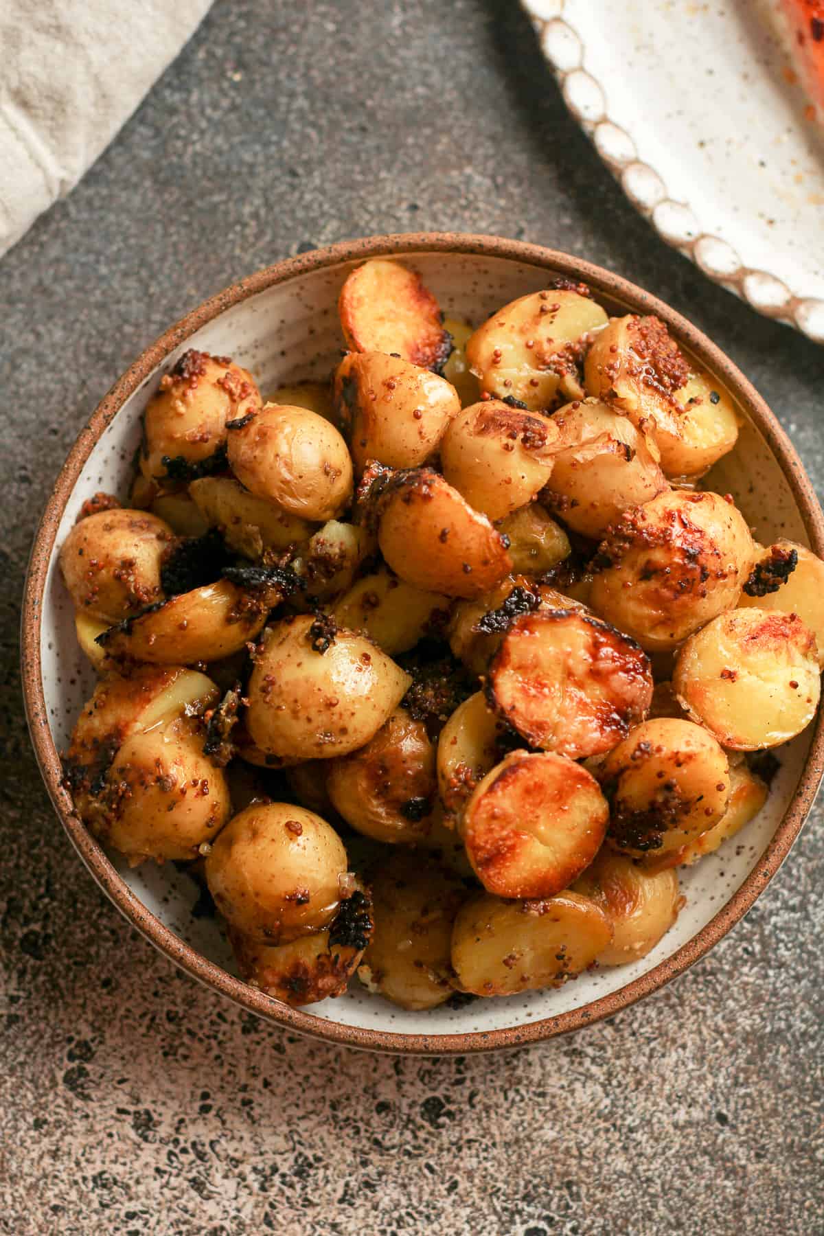 A bowl of grilled mustard potatoes.