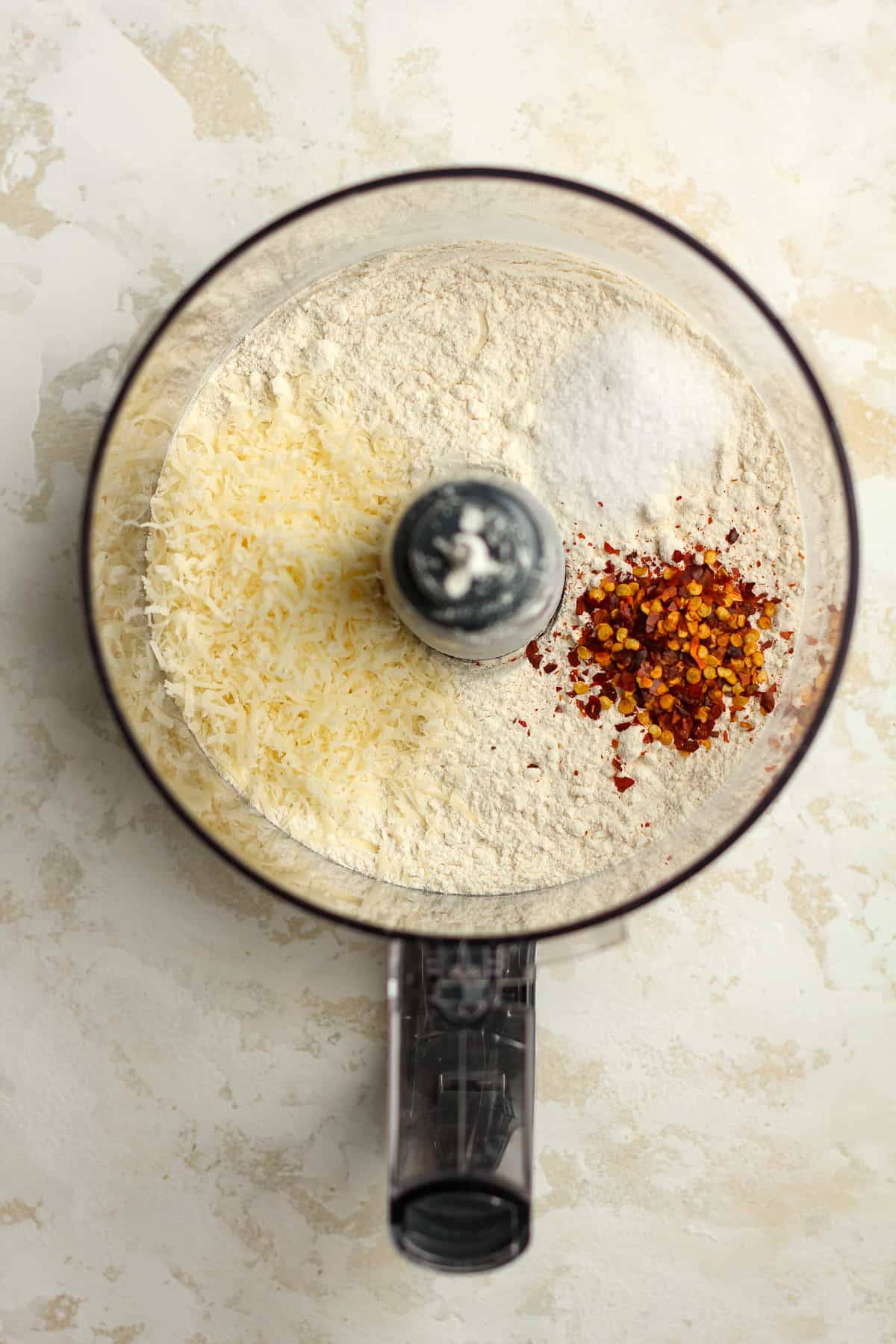 A food processor with the dry ingredients.