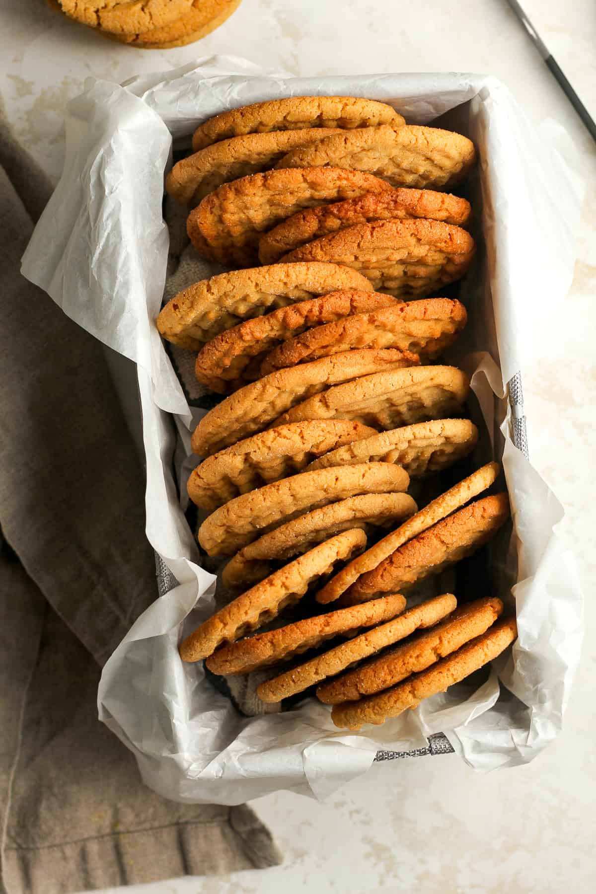 Overhead shot of a rectangular box of the best peanut butter cookies.