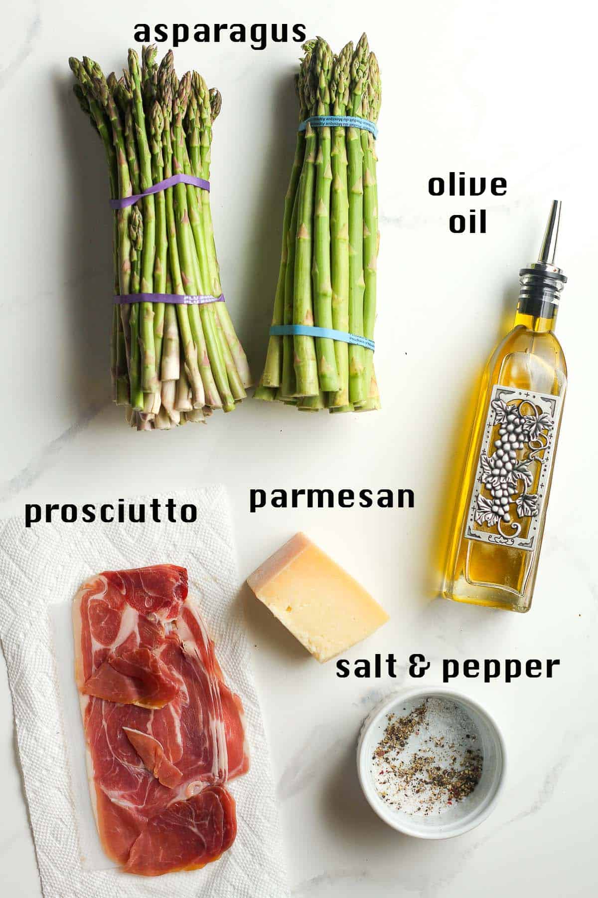The ingredients for the roasted asparagus on a white background.