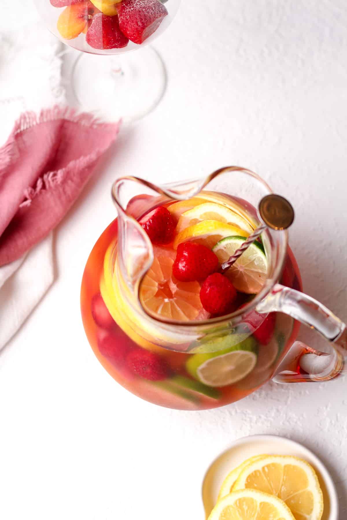 Overhead view of a pitcher of rose sangria.