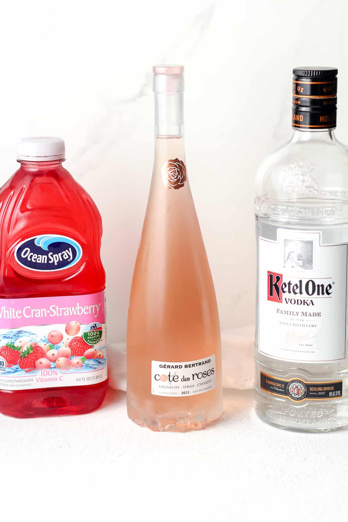A bottle of Cranberry-strawberry juice, rose wine, and vodka.