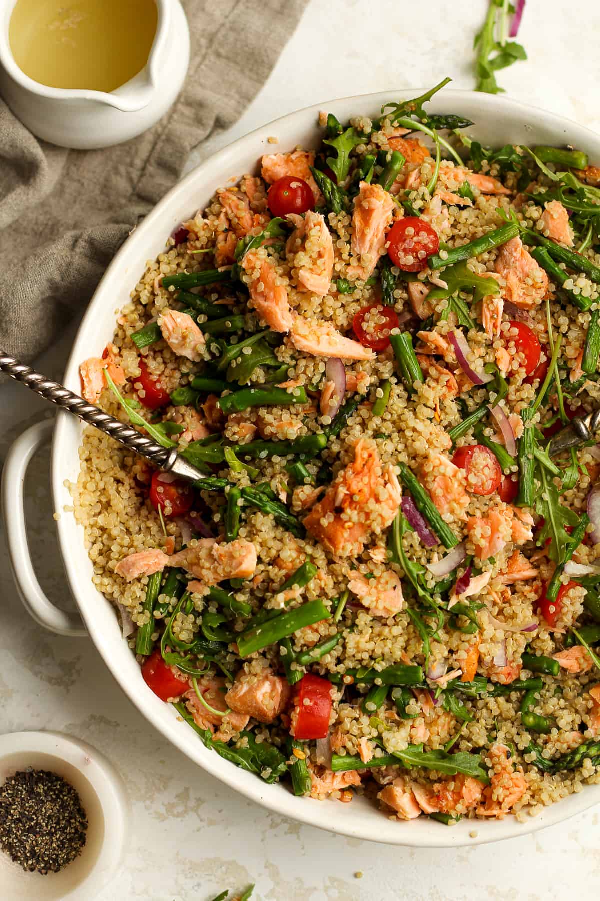 Closeup on a large bowl of salmon quinoa salad.