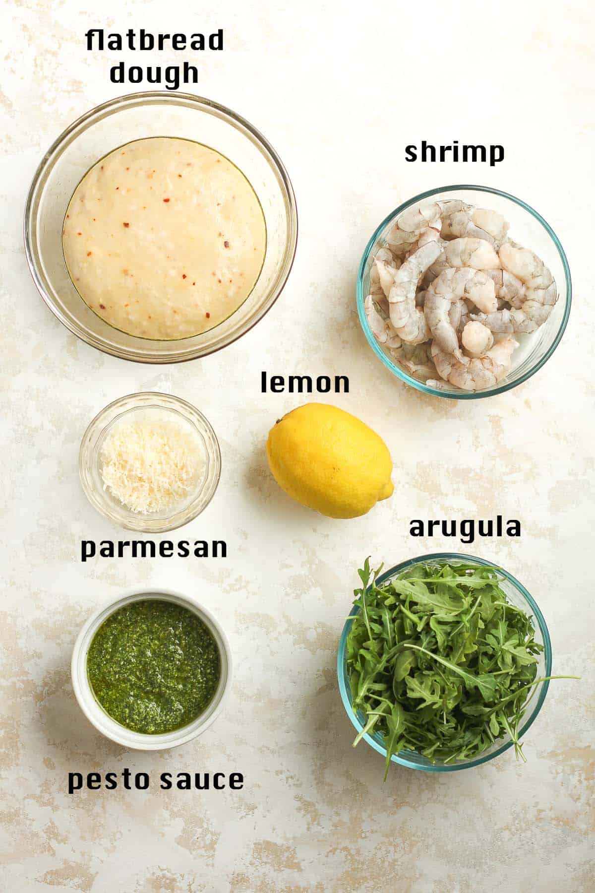 The ingredients for the shrimp pesto flatbread, labeled.