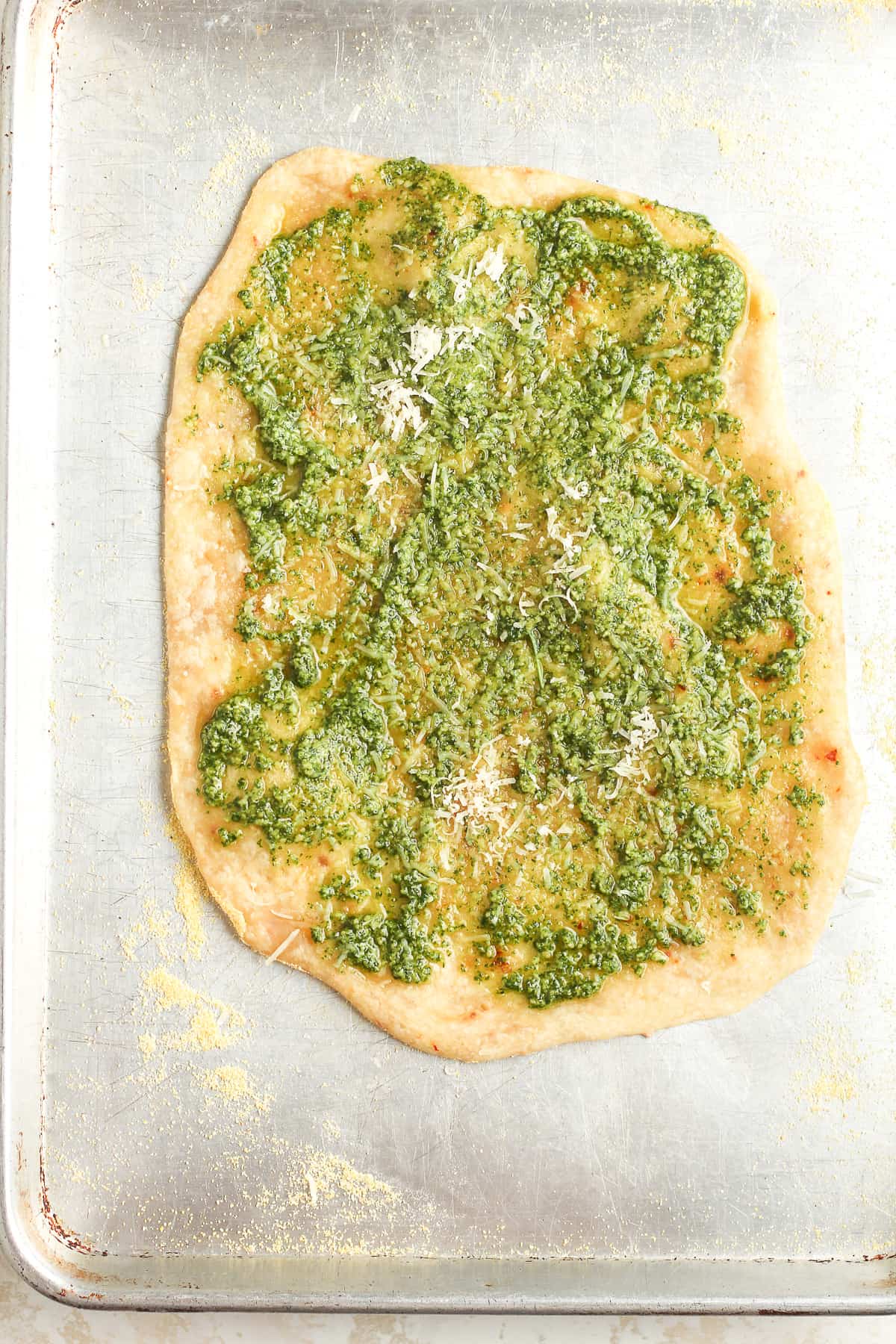 The pre-baked flatbread with the pesto on top.