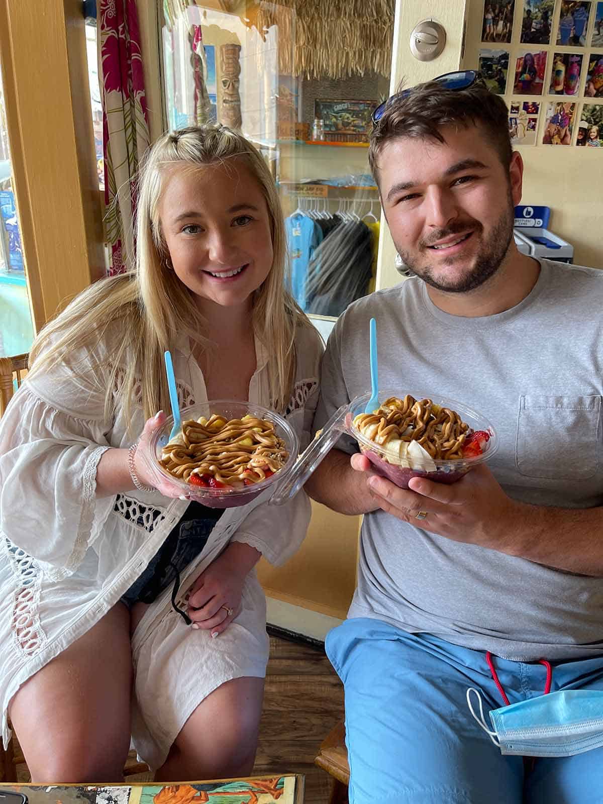 Tiff and Josh eating açaí bowls in Hilo.