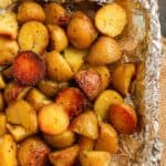 A tin of small potatoes, grilled.