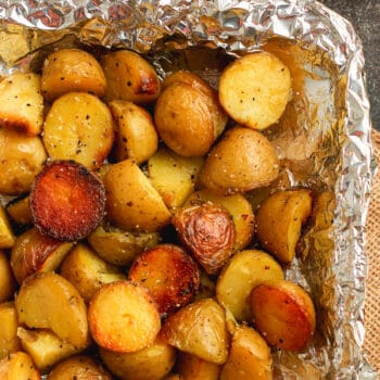 A tin of grilled baby potatoes.
