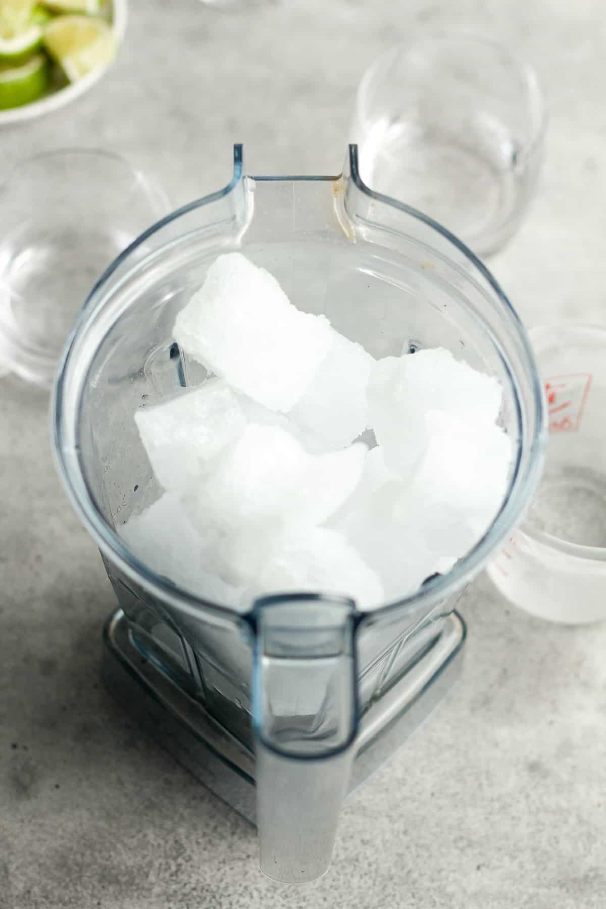 Overhead view of a blender of frozen tonic cubes.
