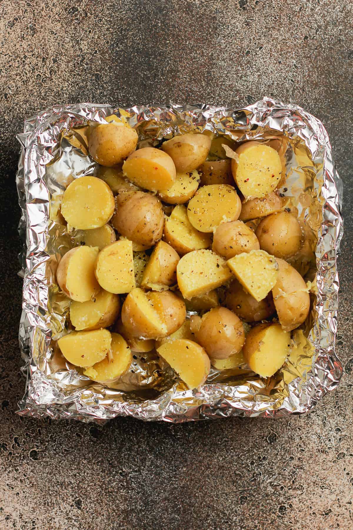 A tin of the boiled and halved baby potatoes.