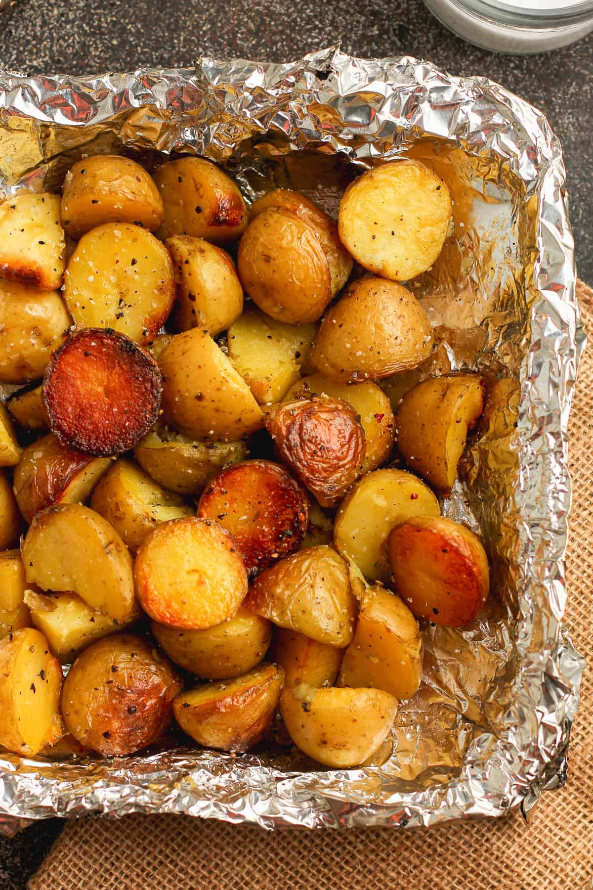 Closeup on a tin of grilled baby potatoes.